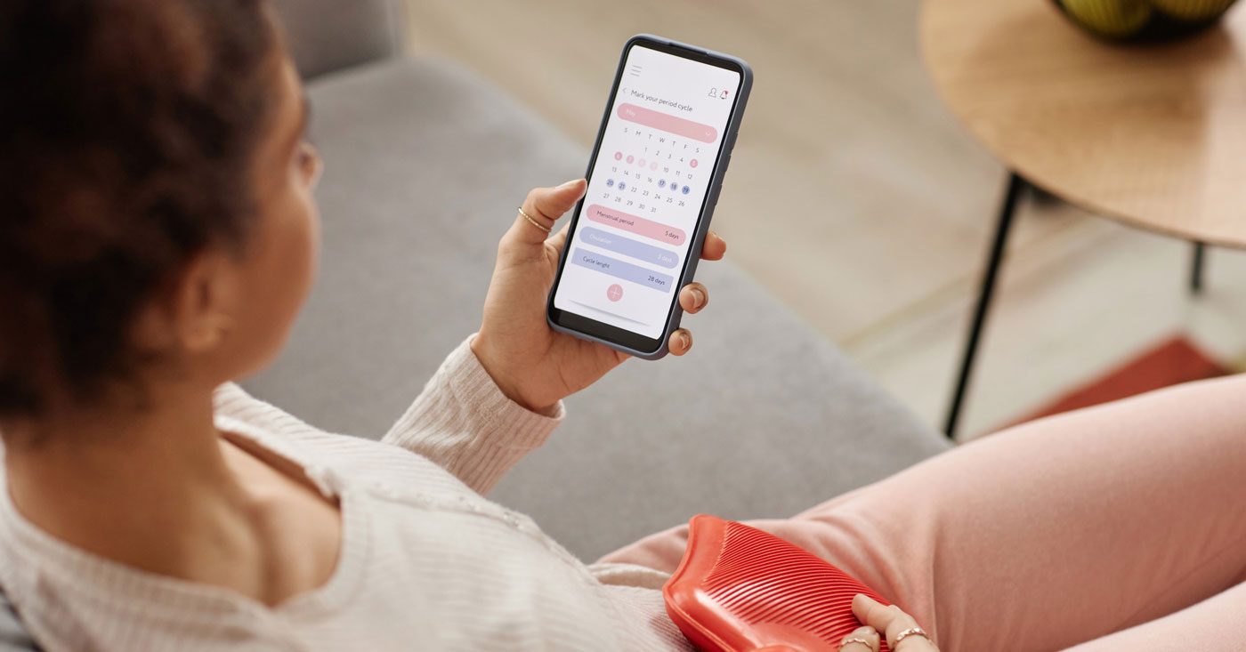 Woman looking at menstrual tracker.