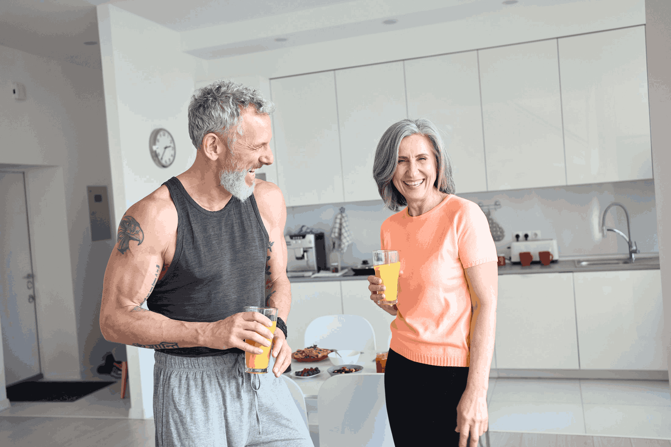 Senior couple drinking juice.